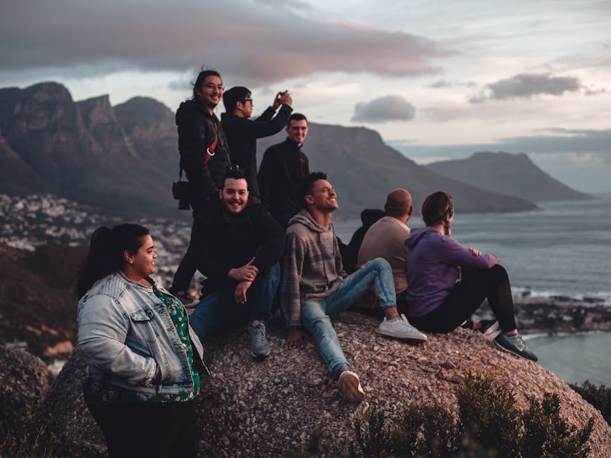 A diverse group of people of different ages sitting together and smiling